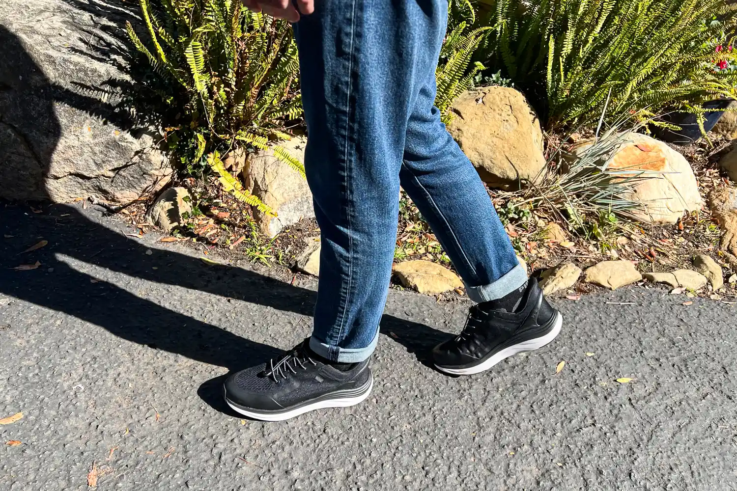 A close-up of a person's legs walking in the Kizik Men's London