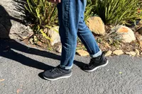 A close-up of a person's legs walking in the Kizik Men's London