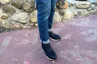 A person's legs posed in the Kizik Men's London