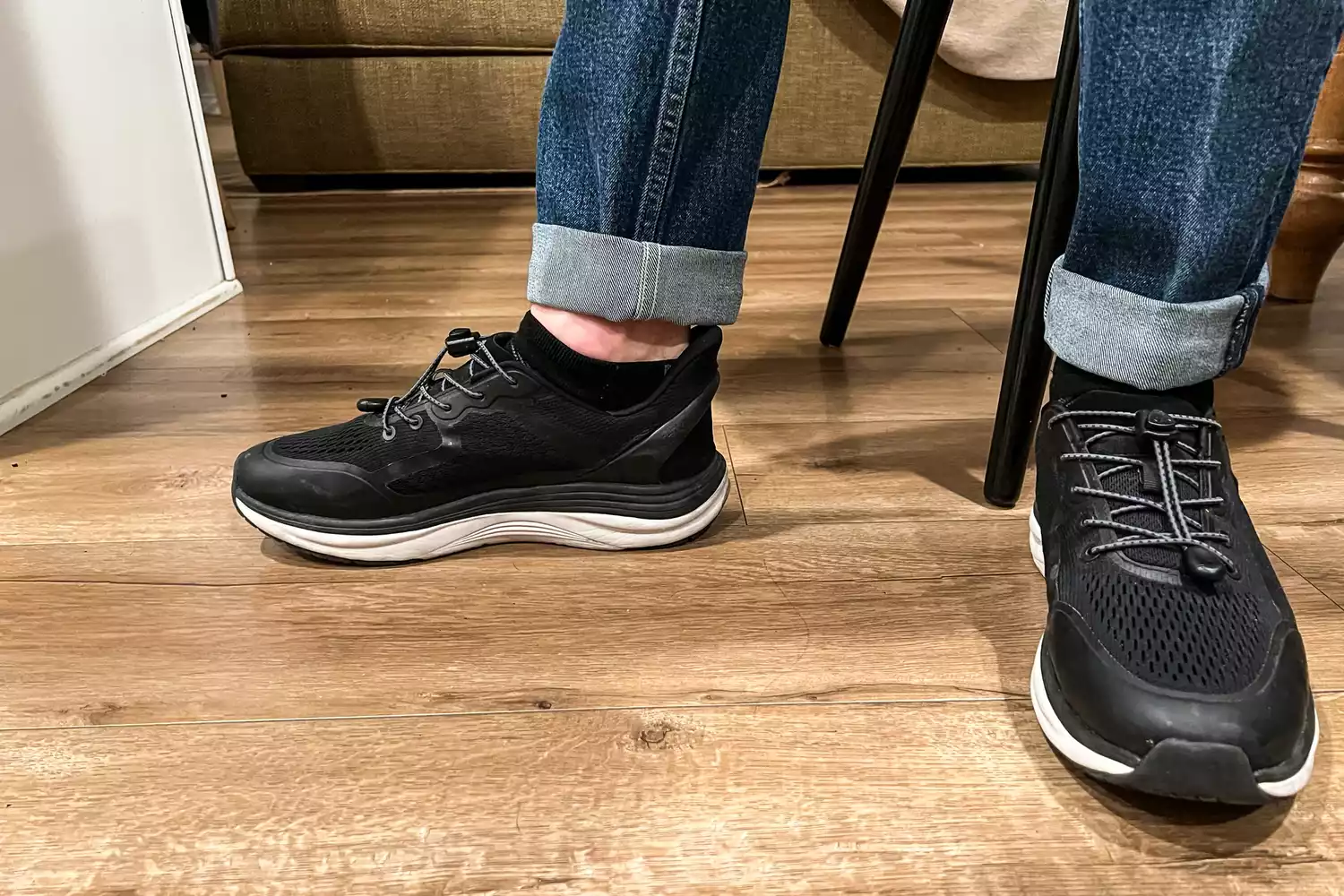 A close-up of a person's feet in the Kizik Men's London