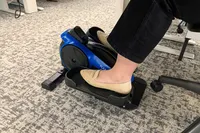 A person pedals the LifePro FlexStride Plus