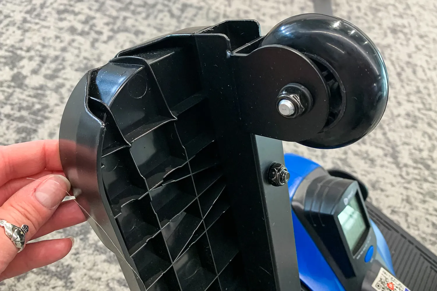 A person touches the pedal of the LifePro FlexStride Plus