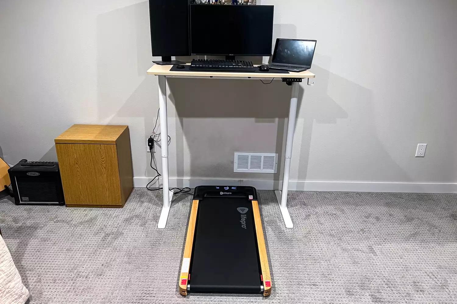 The LifePro TimberTrek Treadmill under a standing desk