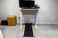The LifePro TimberTrek Treadmill under a standing desk