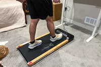A person walking on the LifePro TimberTrek Treadmill