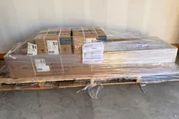 The pieces of the Marcy MWM-989 150 lb Stack Weight Home Gym in packaging before assembly