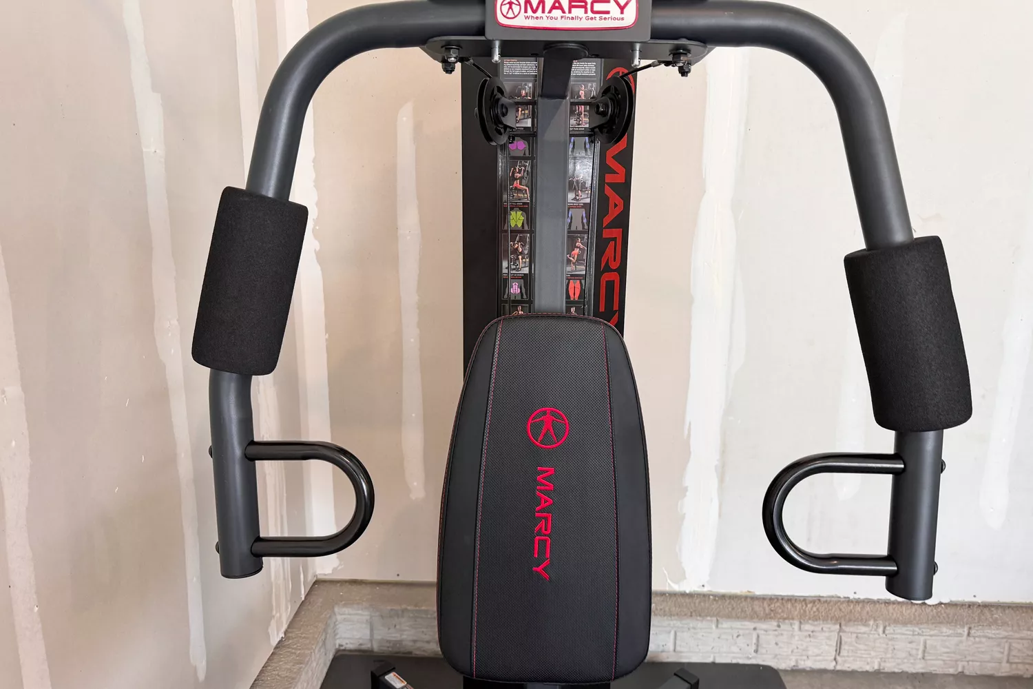 The padded arm press on the Marcy MWM-989 150 lb Stack Weight Home Gym