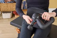 A person assembling the Theragun Prime