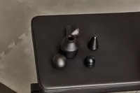 Therabody Theragun Prime (4th Generation) attachments on a weight bench