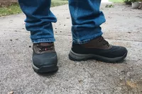 A person wears Nortive 8 Menâs Insulated Snow Boots outside