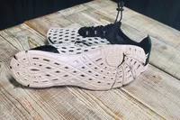 Doussprt Men’s Quick Drying Water Shoes on wood 