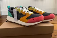 The Merrell Women's Alpine 83 Sneaker Sport sneakers with tags posed on their box