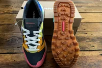 The Merrell Women's Alpine 83 Sneaker Sport sneakers posed on their box
