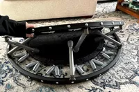 A person slowly folds up the Needak Soft-Bounce Folding Rebounder