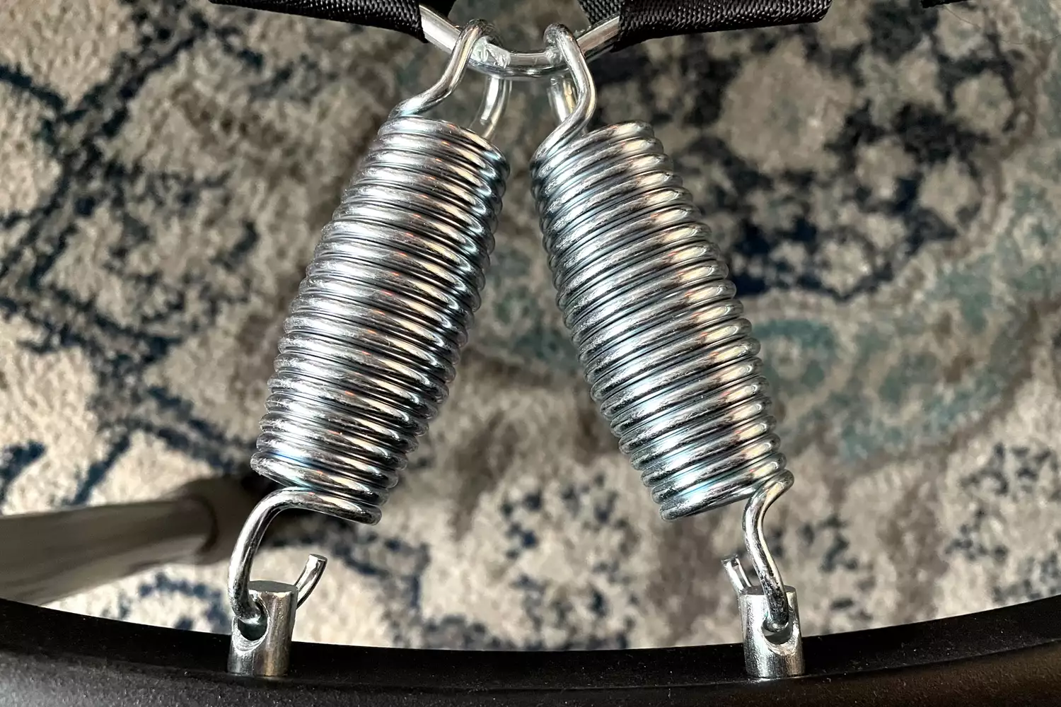 A close-up of the metal springs on the Needak Soft-Bounce Folding Rebounder