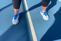 A person wears the New Balance Women's FuelCell 996v6 Pickleball Shoes while playing pickleball