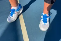 A person wears the New Balance Women's FuelCell 996v6 Pickleball Shoes on a court