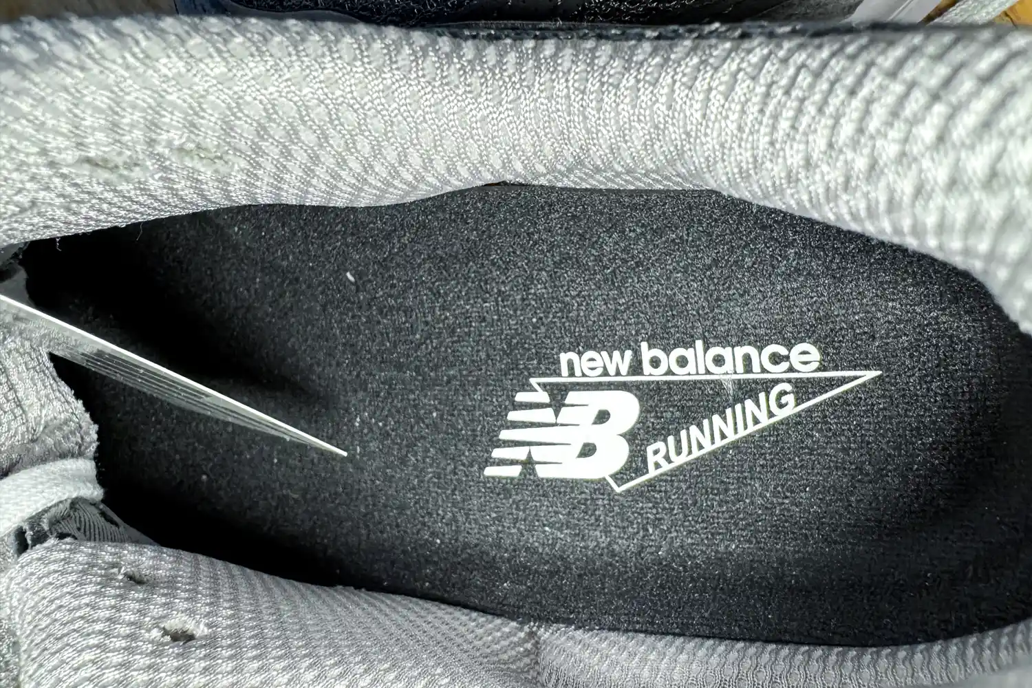 The brand name and logo printed on the inside of the New Balance Women's Made in USA 990v6 Sneakers