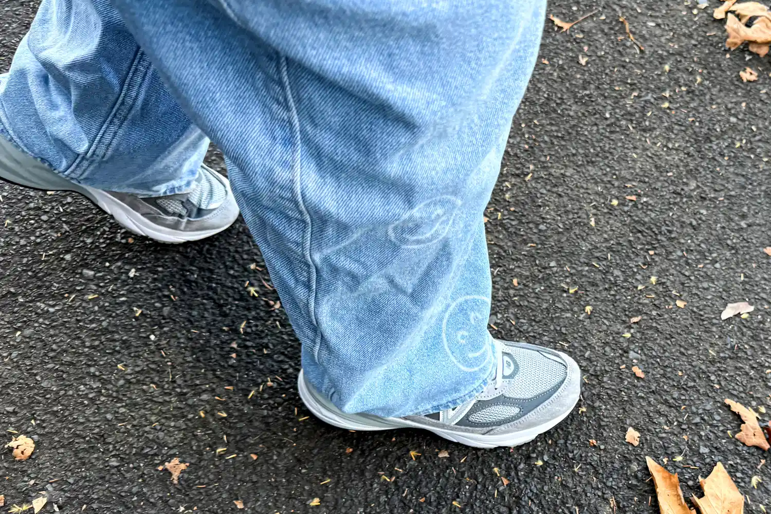 A person walks outside while wearing the New Balance Women's Made in USA 990v6 Sneakers