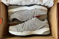 A pair of New Balance Men's 608v5 Cross Trainer Shoes inside a shoebox 