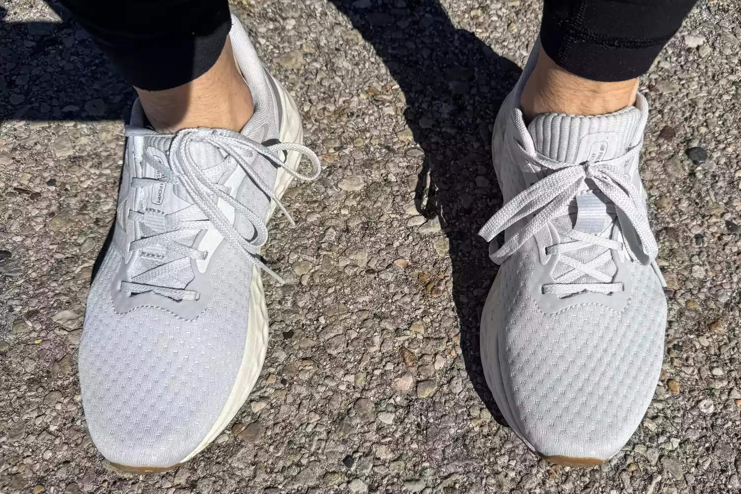 An overhead view of the New Balance Women's Fresh Foam Arishi v4 sneakers worn outdoors
