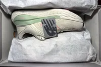 A pair of New Balance Women's Made in USA Fresh Foam X 1540v4 Running Shoes in a shoebox