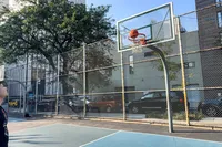 A person shoots the Nike Elite Championship Basketball