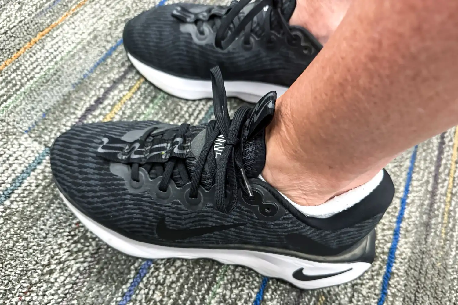 A close-up of a pair of Nike Motiva Women's Walking Shoes