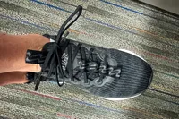 A person wears the Nike Motiva Women's Walking Shoe