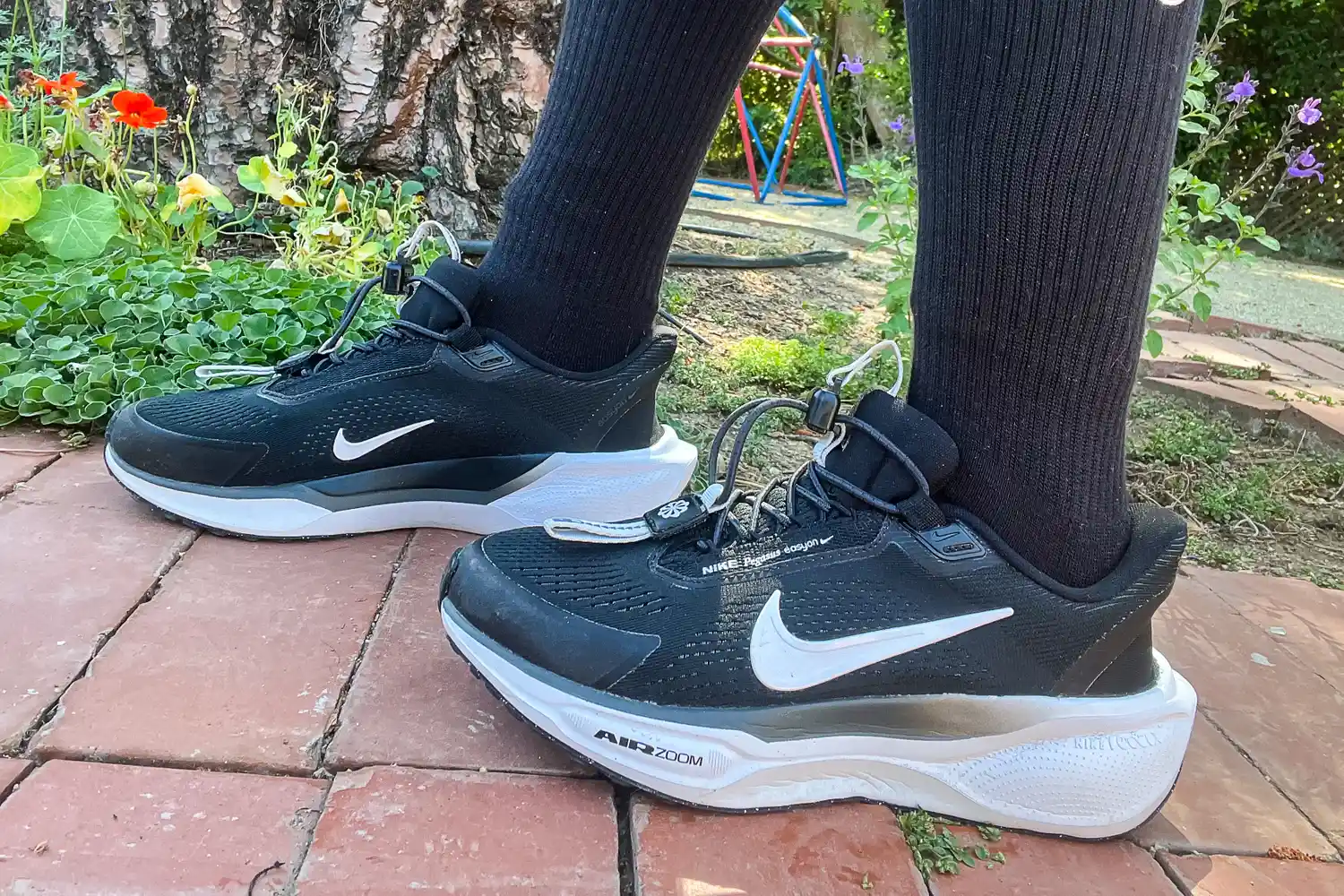 A side view of a person wearing the Nike Pegasus EasyOn Women's Road Running Shoes