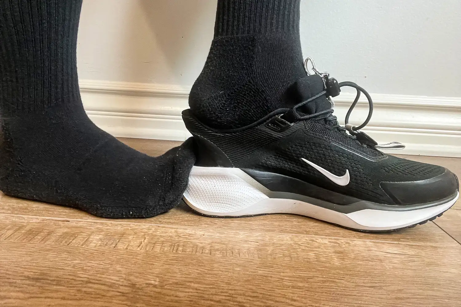 A person slips their foot out of the Nike Pegasus EasyOn Women's Road Running Shoes