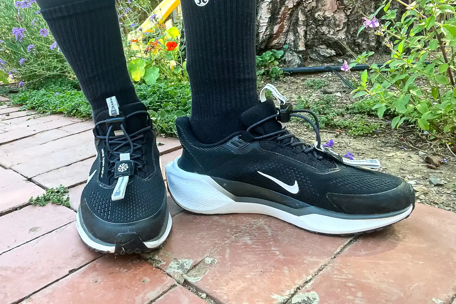 A side view of a person wearing the Nike Pegasus EasyOn Women's Road Running Shoes