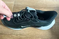 A person examines the Nike Pegasus EasyOn Women's Road Running Shoes