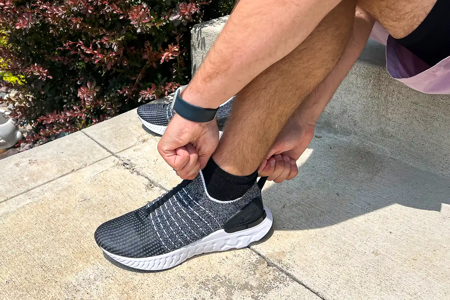 A person wears the Nike React Phantom Run 2 Men's Road Running Shoes