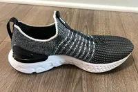 The Nike React Phantom Run 2 Men's Road Running Shoe on a wooden floor