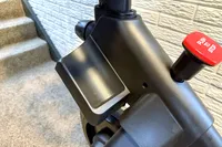 The cup holder and emergency stop button on the NordicTrack X24 Bike