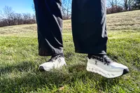 A person wears the On Men's Cloudtilt Walking Shoes