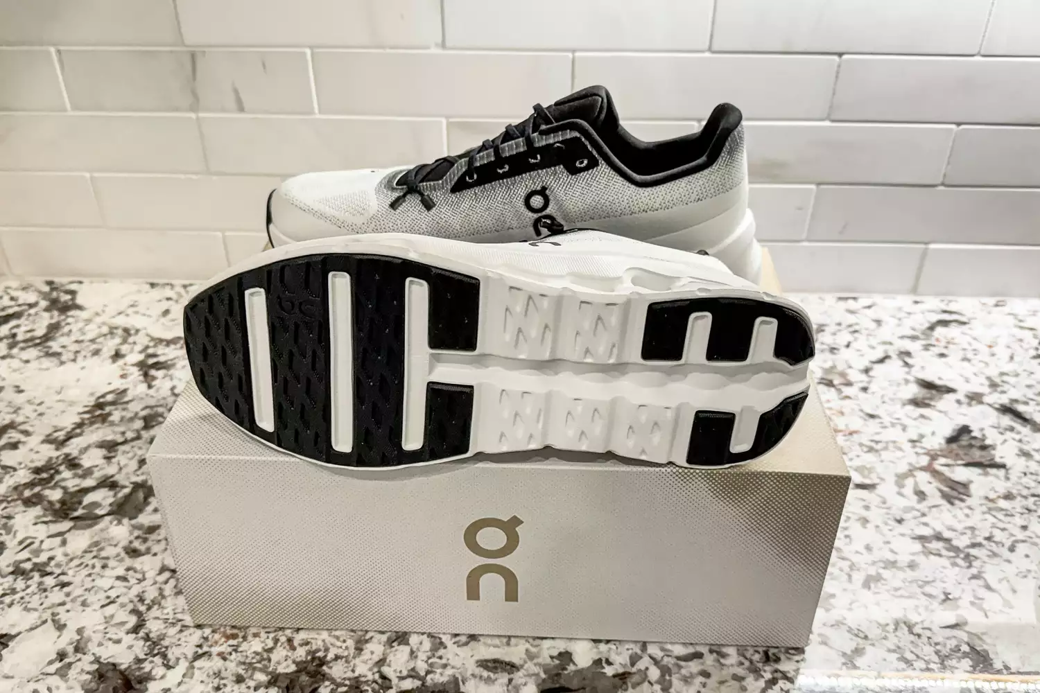 The treads on the bottom of the On Men's Cloudtilt Walking Shoes