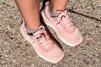 A close-up of person's feet wearing Orthofeet Women's Relay Sneakers