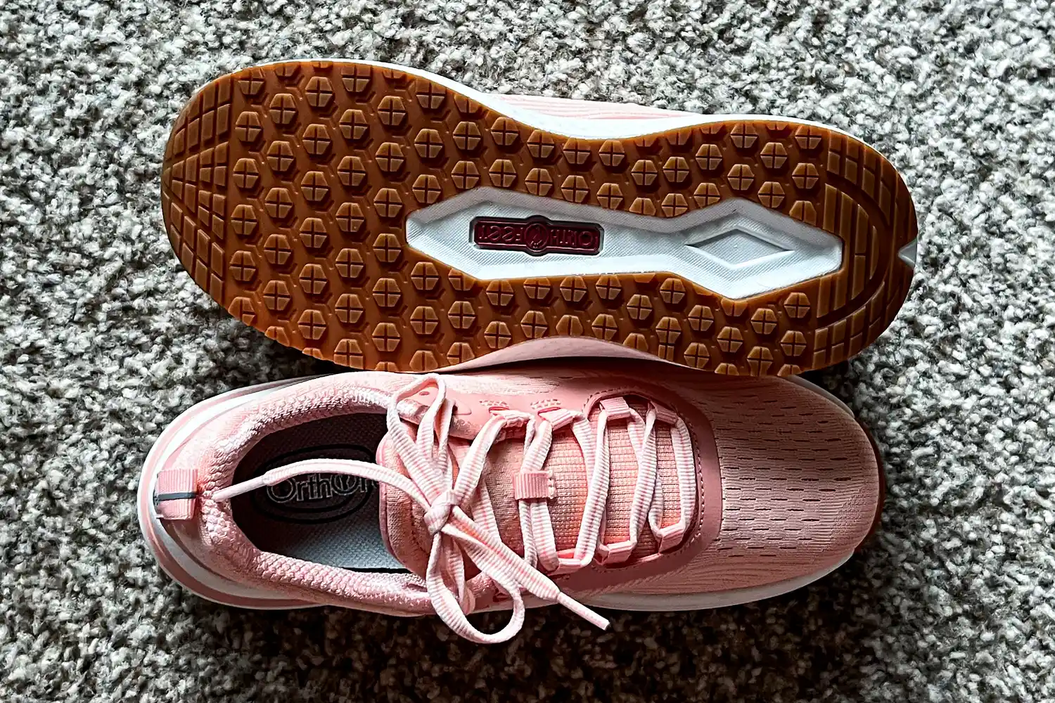 The treads on the bottom and the laces on the top of a pair of Orthofeet Women's Relay Sneakers