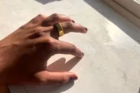 A person wears the Oura Ring 4