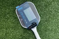 Selkirk SLK Evo Power 2.0 Pickleball Paddle laying on turf grass