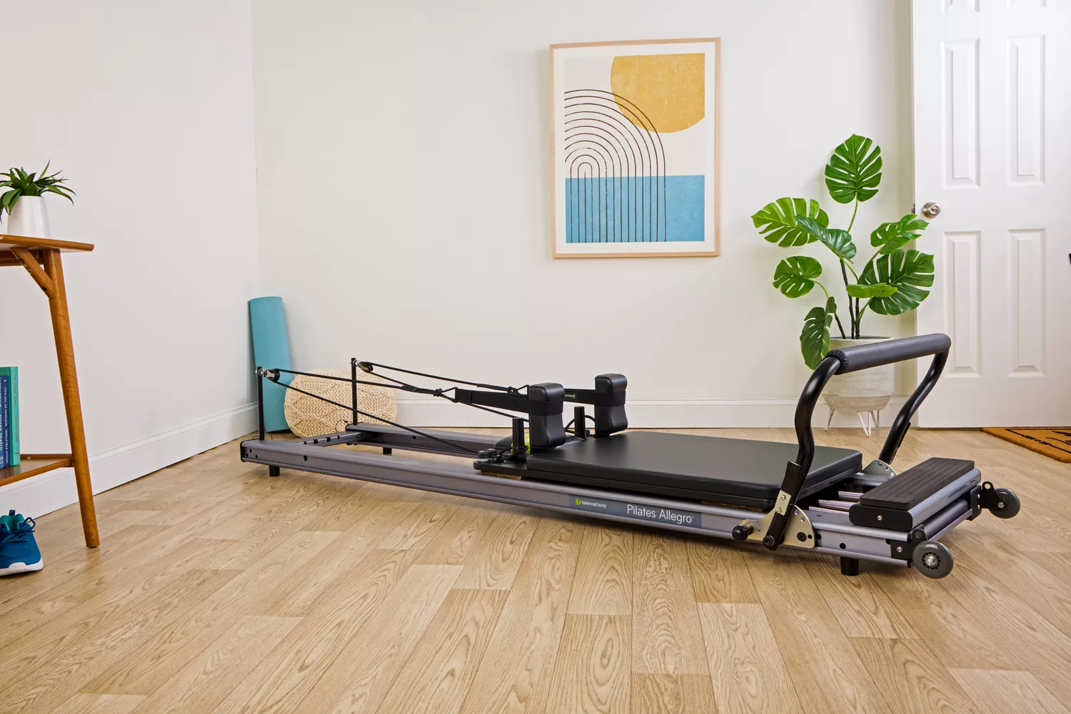 The Balanced Body Allegro Reformer in the corner of a room