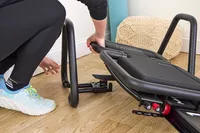 A person assembles the Lagree Micro Reformer