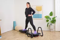 A person exercises on the Lagree Micro Reformer