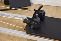 A closeup of the Merrithew At Home SPX Reformer Bundle
