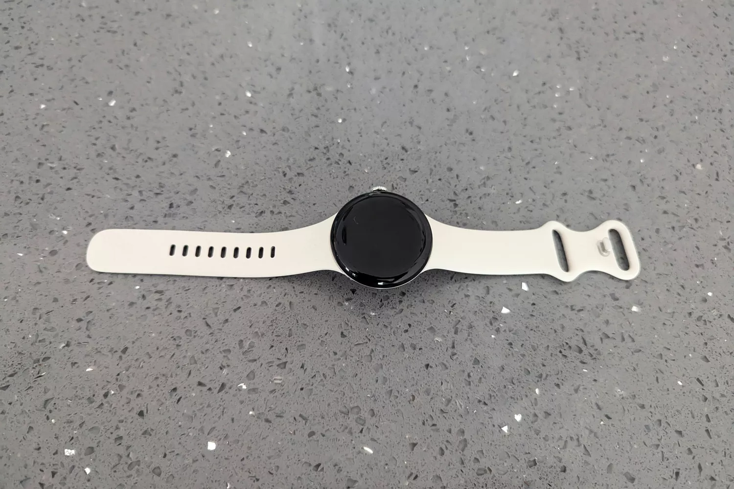 The Google Pixel Watch 3 on a countertop