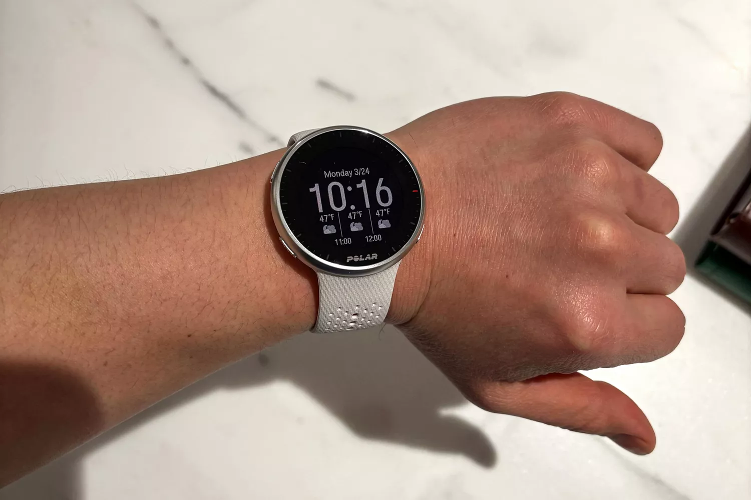 A person wears the Polar Pacer Pro Advanced GPS Sports Watch