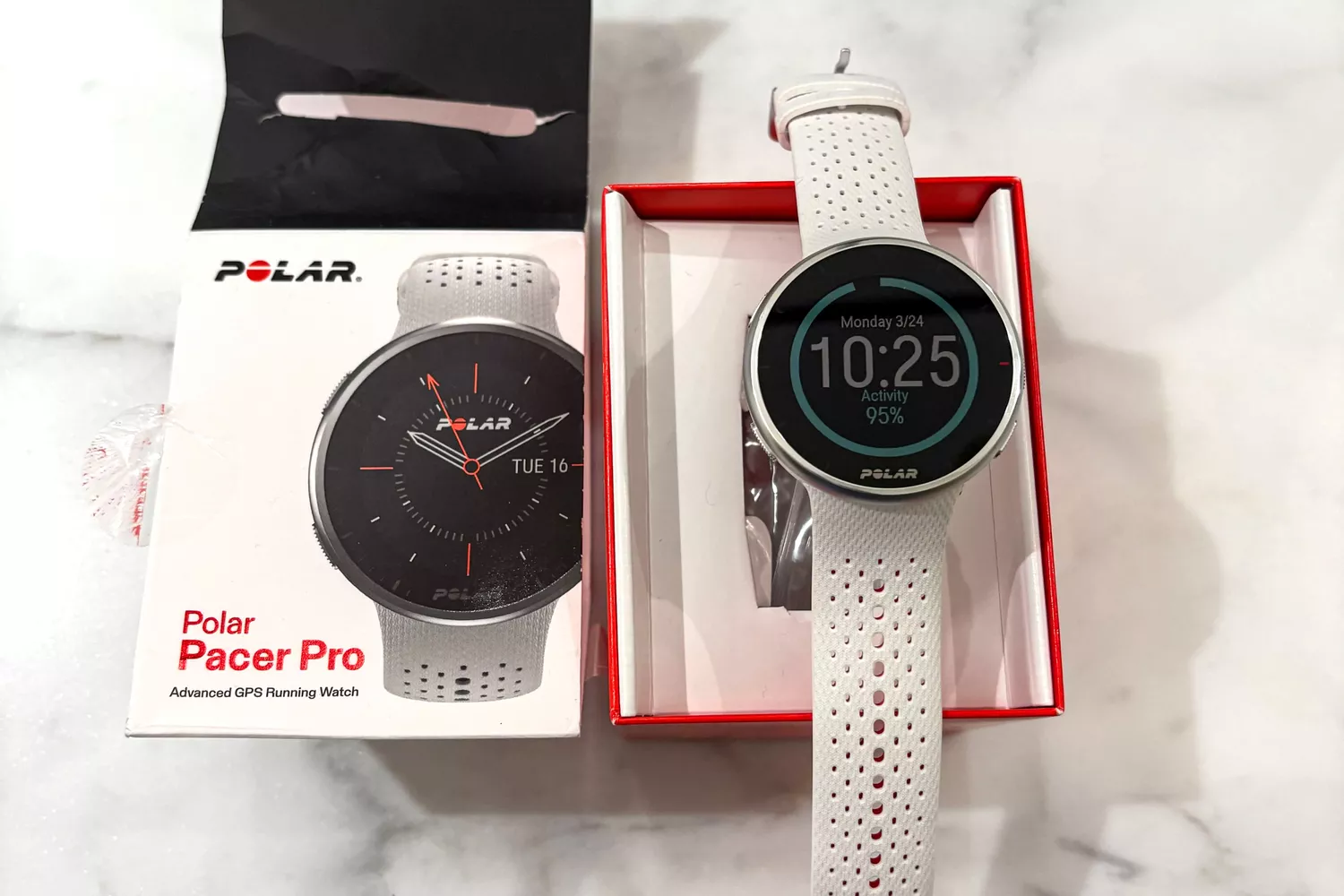 The Polar Pacer Pro Advanced GPS Sports Watch in a branded box