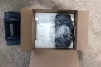 The POWERBLOCK Sport 24 Adjustable Dumbbell in shipping packaging